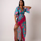 Long kaftan dress with vibrant flowers and flattering wrap style! It is made from lightweight muslin fabric