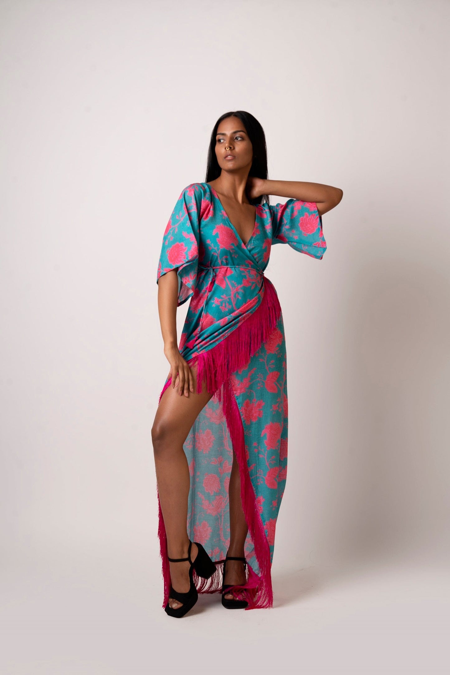 Long kaftan dress with vibrant flowers and flattering wrap style! It is made from lightweight muslin fabric