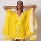 Yellow tie-dye cotton kaftan dress with lace and shell details, ideal for beach vacations and resort wear